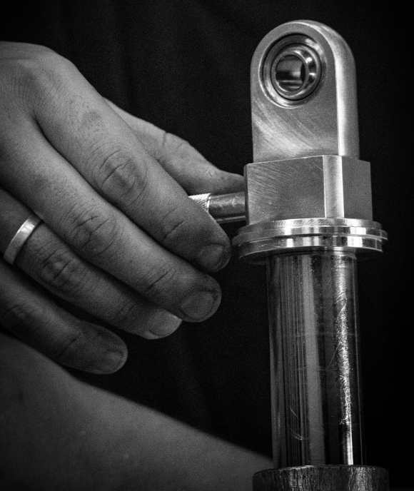Hands holding a finished Nimbus rod and eye assembly