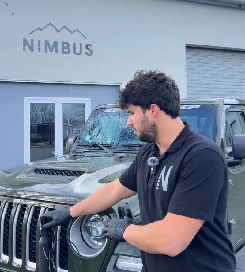 Killian connecting ∆P to a Jeep suspension valve outside the Nimbus workshop