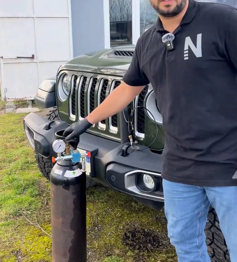 Killian refilling a ∆P cartridge from a workshop nitrogen cylinder