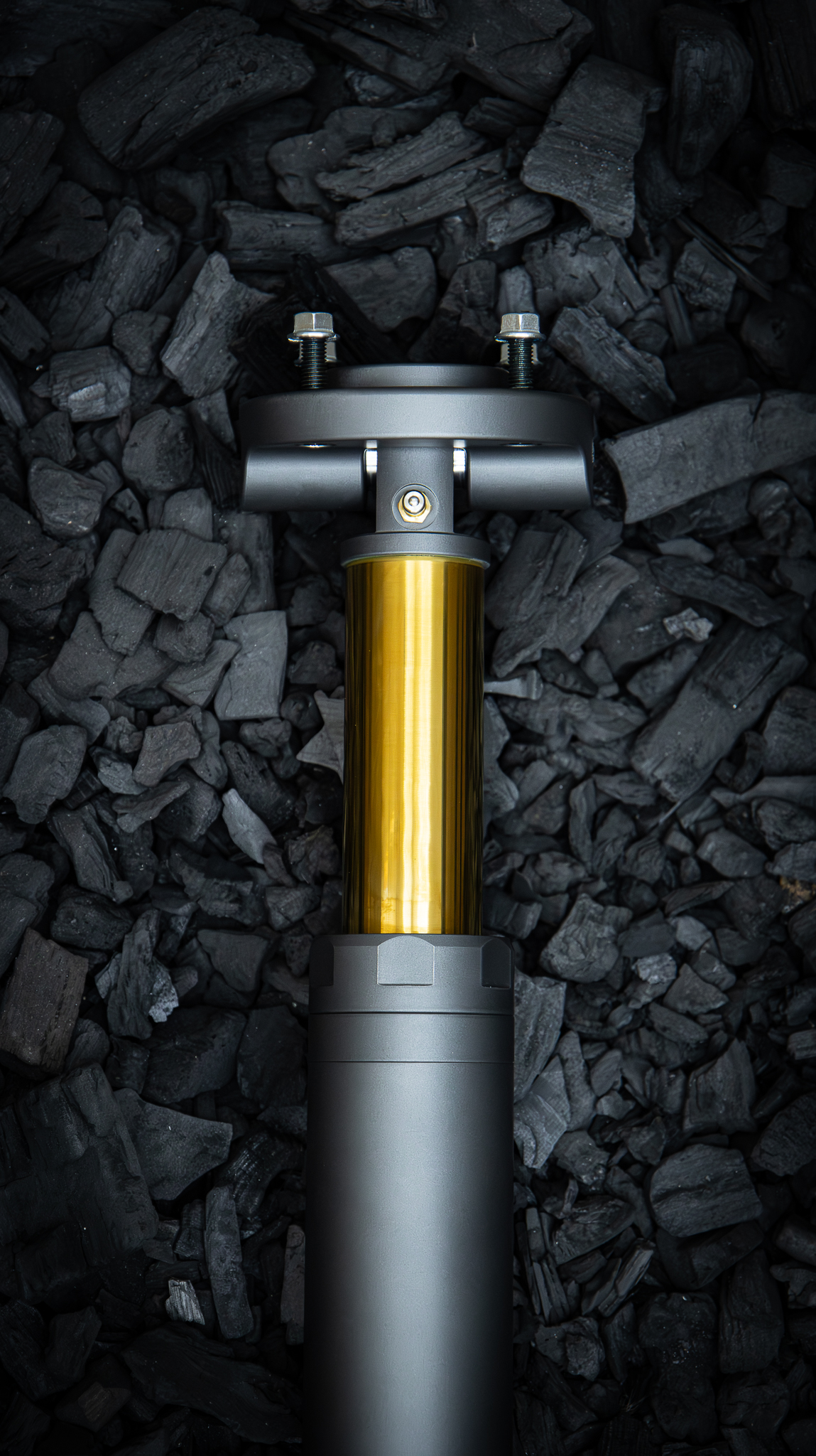 Nimbus Goliath V2 oleo-pneumatic suspension unit with gold TiN piston rod on charcoal