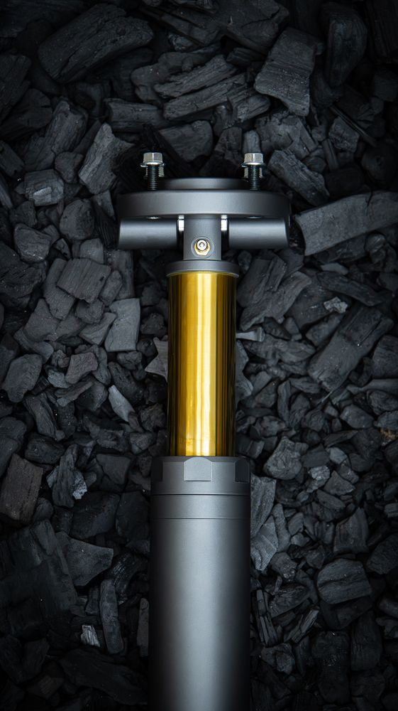 Nimbus Goliath V2 oleo-pneumatic suspension unit with gold TiN piston rod on charcoal