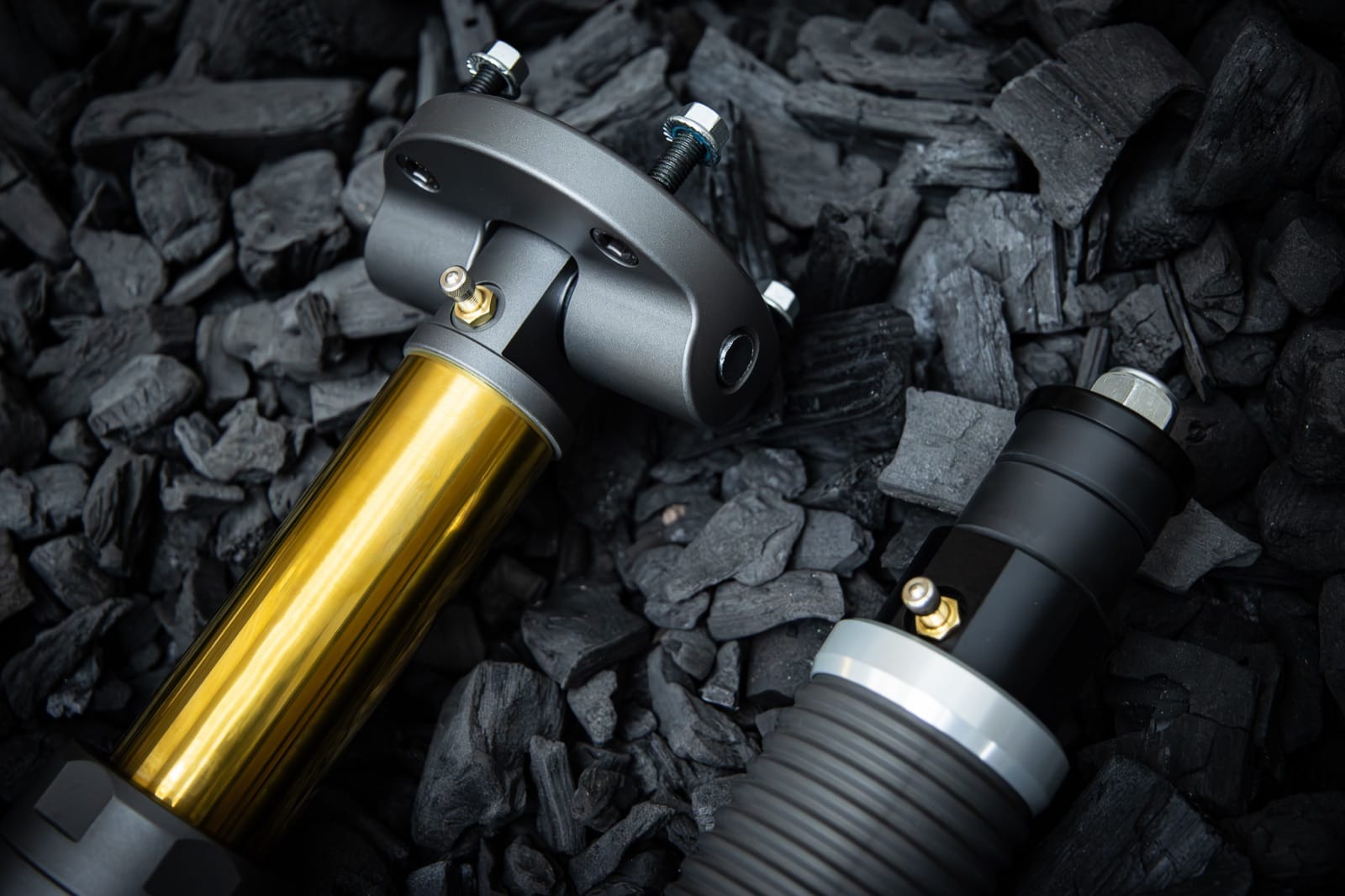Nimbus Goliath V2 and Erebus suspension units side by side on charcoal